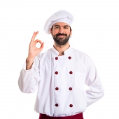 Chef making Ok sign over white background