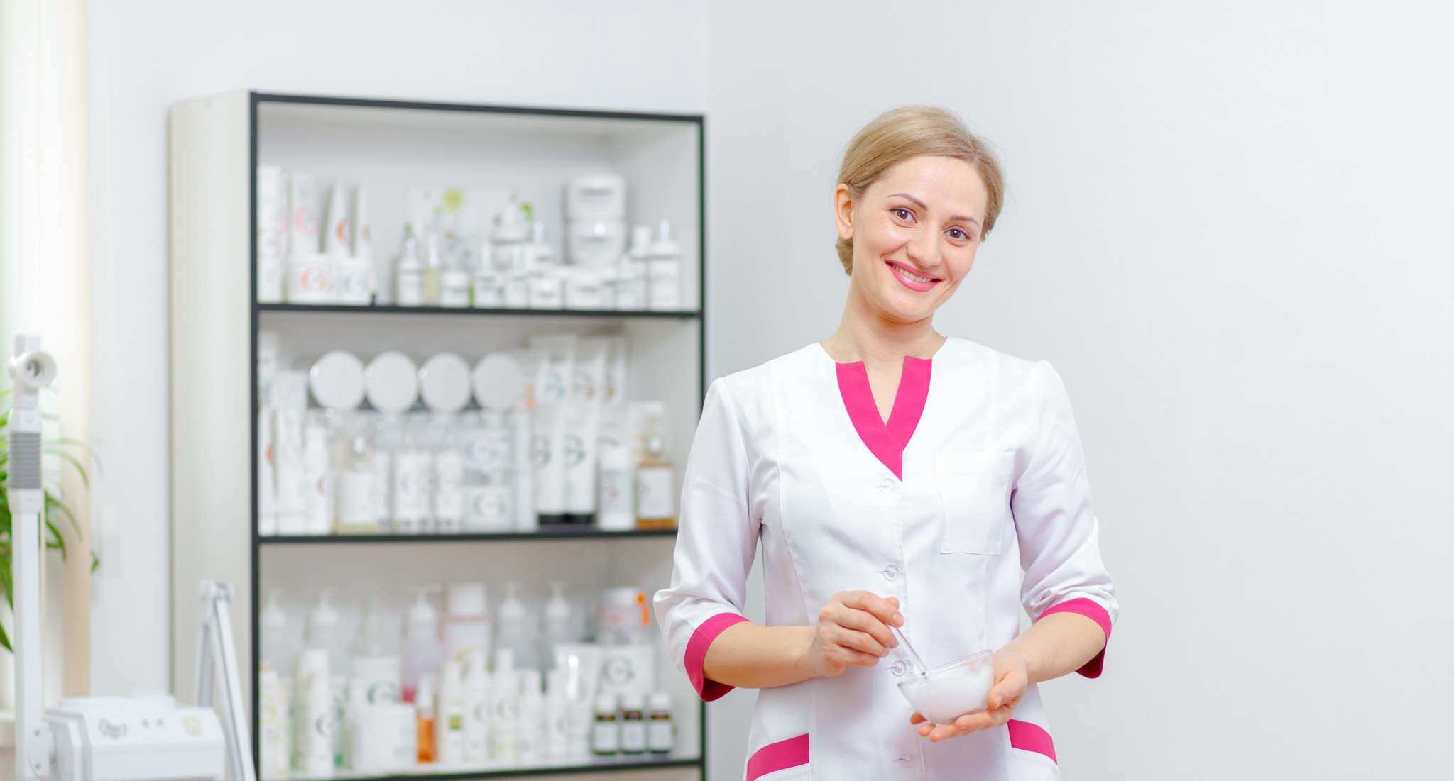 Young woman beautician is doing the cleaning procedure