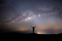 silhouette-successful-man-top-hill-background-with-stars