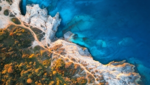 aerial-view-of-blue-sea-rocks-in-clear-water-bea-2022-05-30-14-36-23-utc