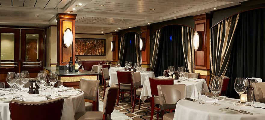 A restaurant with tables and chairs
Description automatically generated