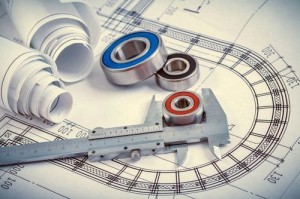 Rolled up construction plans roller bearings and slide caliper o