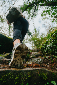low angle view of a person hiking up a stone pathway 一个人爬上石道的低角度视角