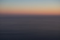 body of water during sunset