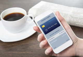 businesswoman hand holding a phone with mobile wallet onlain sho