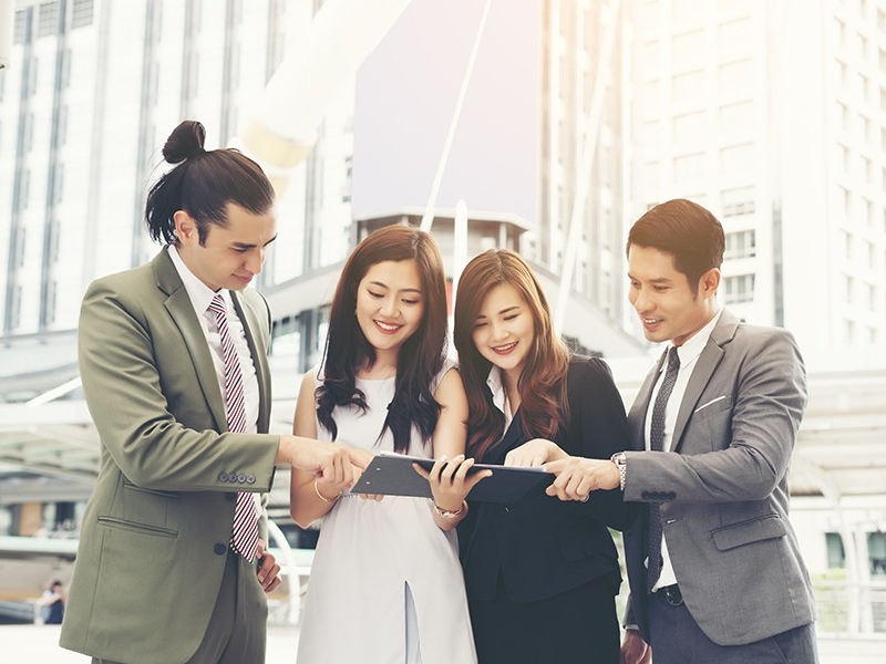 W800_business-teamwork-with-touch-pad-her-hands-watching-some-interesting-content-lunch-break