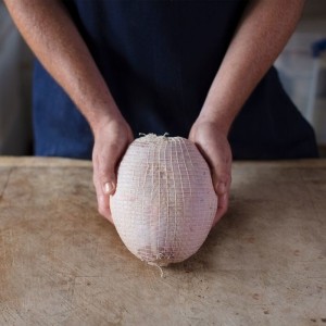 Raw Netted Turkey Breast Skin on Oven Ready