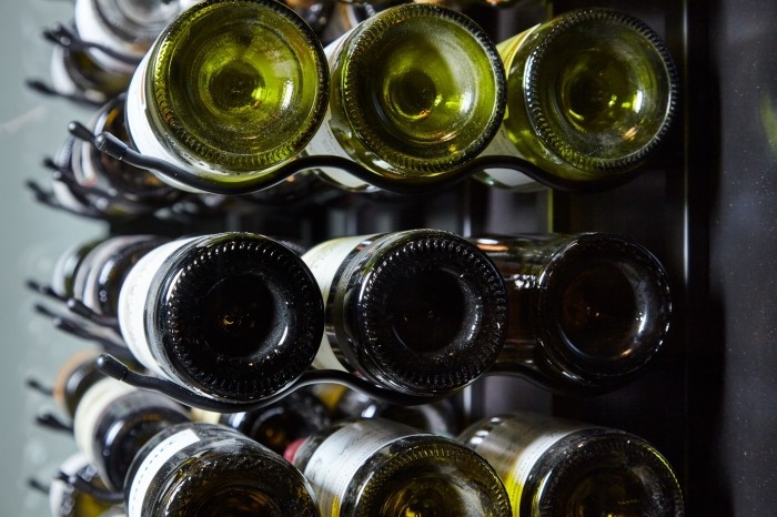 Close-up-of-Racking-in-Glass-Wine-Cellar