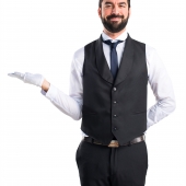 Luxury waiter holding something
