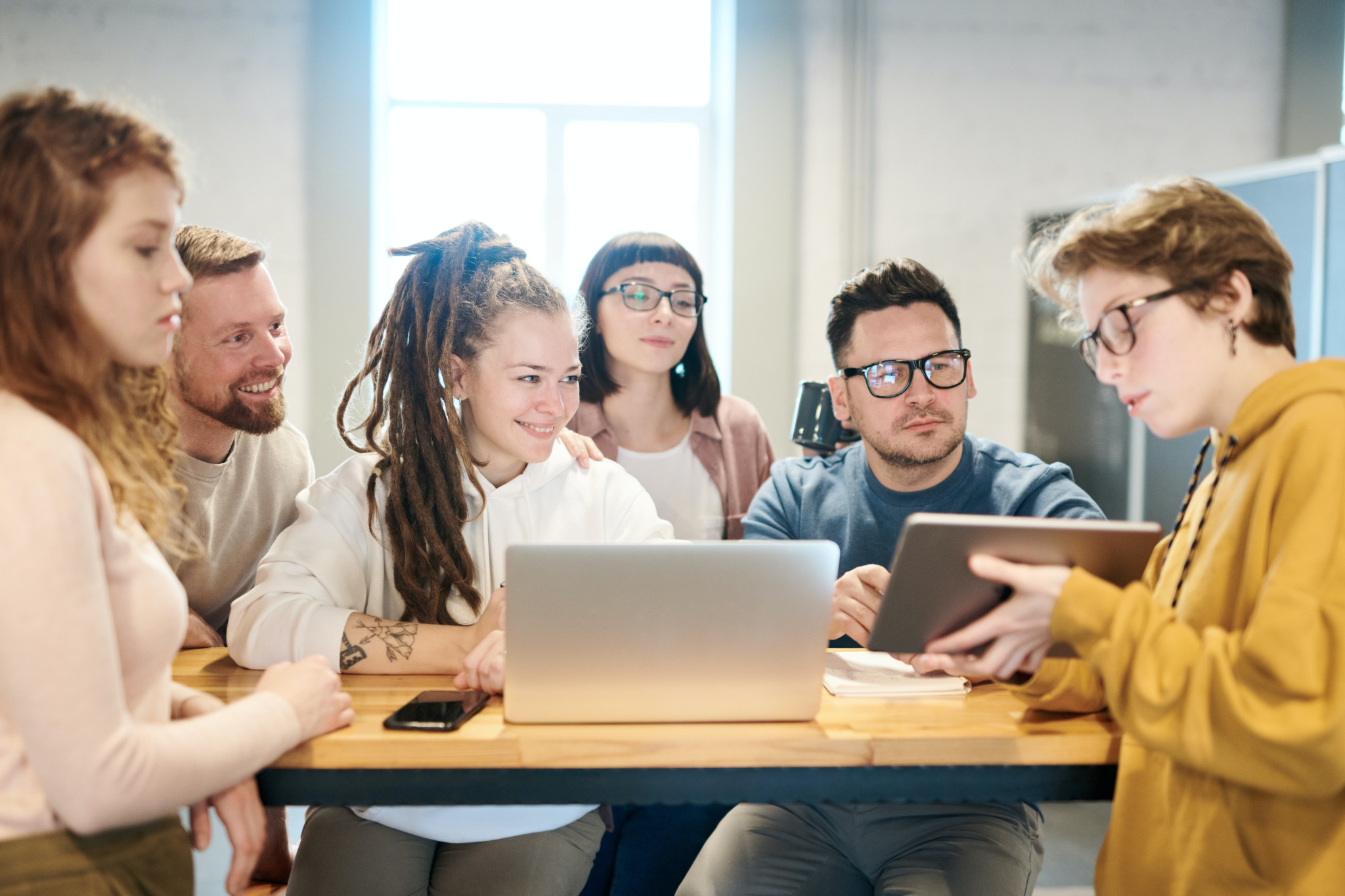 photo-of-people-looking-on-tablet-3182835